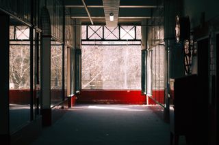 A corridor inside The Nicholas Building, looking down at a window.