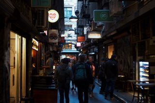 People walking through Centreway Arcade.